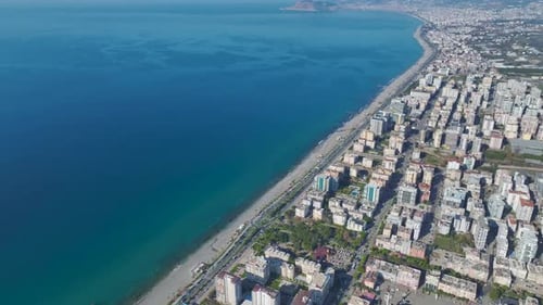 Aerial Video Scenic Perspective of a Coastal City With Modern Buildings and Stunning Mediterranean