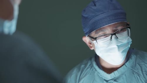 Close up of a male surgeon performing a procedure