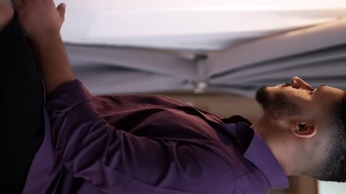 Young Man Drinking From a Mug Indoors