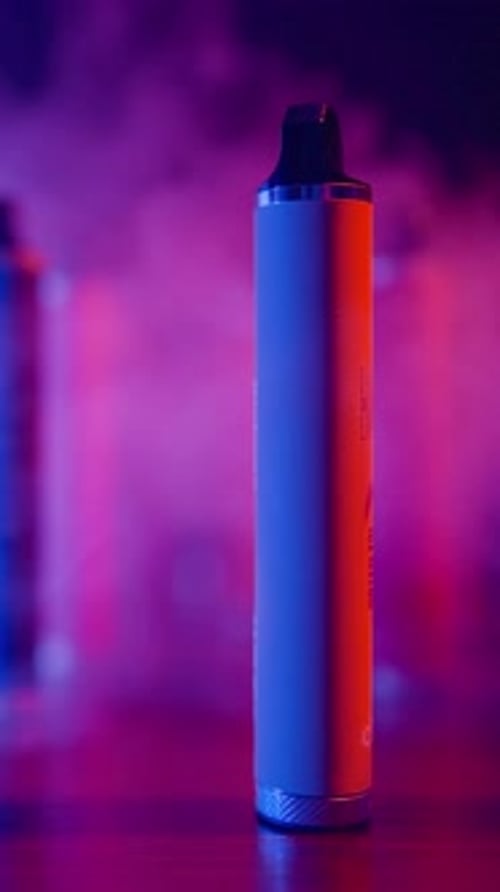 Vape Pen Product on Reflective Surface with Fog