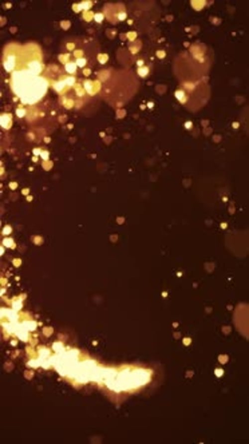Corações dourados brilhantes e partículas girando