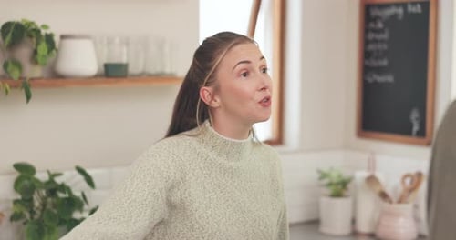 Woman Talking with Man in Bright Kitchen