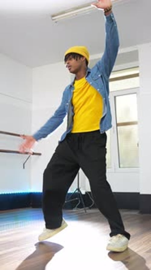Energetic Young Man Dancing Afro Hip Hop in Studio