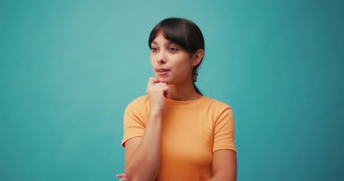 Woman Thinking Gets an Idea in Studio