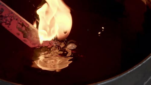 Red Hot Metal Quenched in Dark Liquid