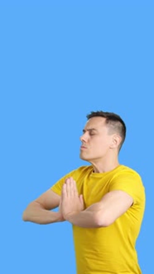 Man Taking a Deep Breath While Meditating