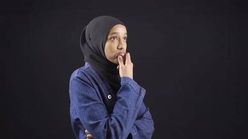Worried Woman in Headscarf Thinking Hard