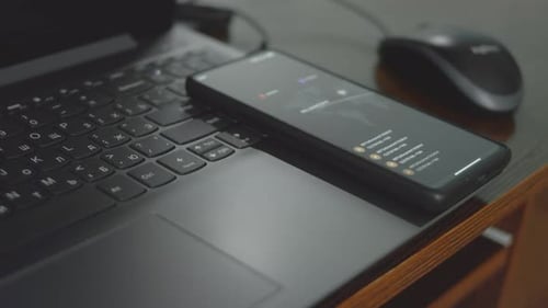 Laptop and Smartphone on a Table