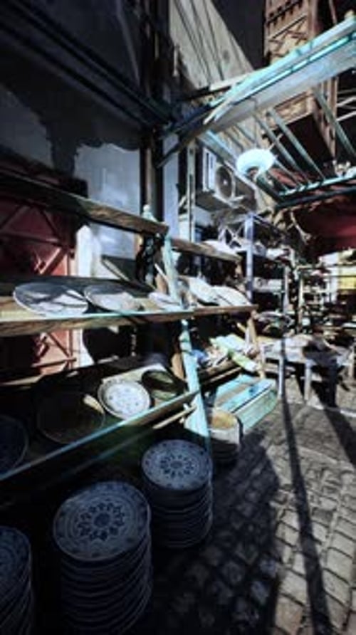 Camera Dolly Through Traditional Market Stall with Ornate Plates