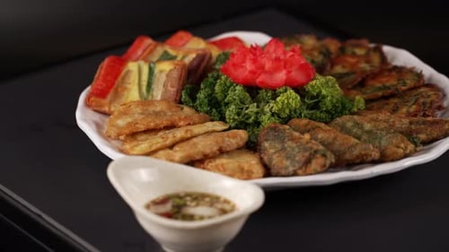 Plate of Savory Pancakes with Dipping Sauce