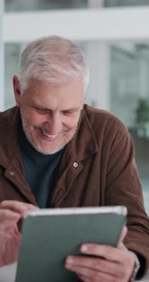 Mature man, tablet and smile at startup, scroll and review with project management at media company