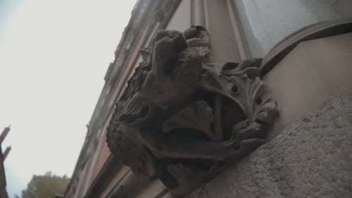Gargoyle statue on the side of old court building in Manchester UK