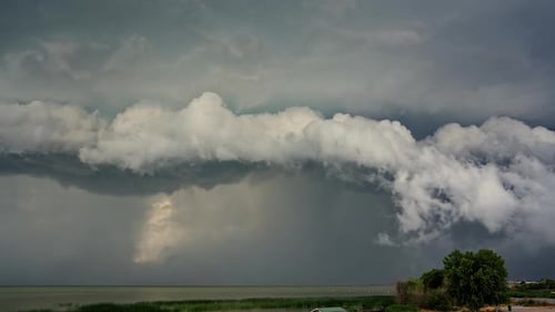 Timelapse of clouds rolling in front of rainstorm over Utah Lake