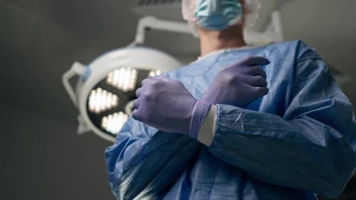 Close Up Hands in a Modern Clinic in a Bright Spacious Operating Room the Surgeon is Fully Prepared