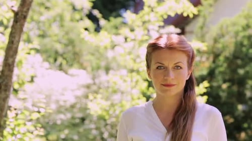 Smiling Woman in Garden Setting