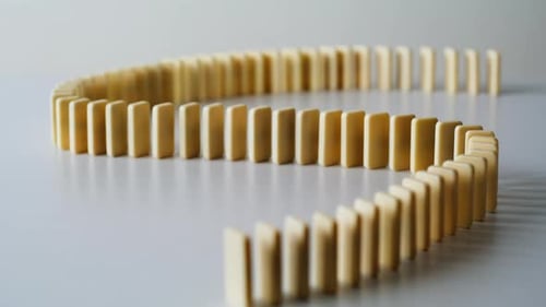 Figure Dominoes Placed Table Closeup Wavy Line with Toy Bricks Arranged Surface