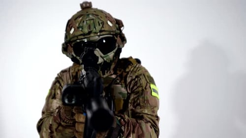 Aggressive Soldier Aiming By Modern Rifle to Camera Portrait in Studio War and Army Concept