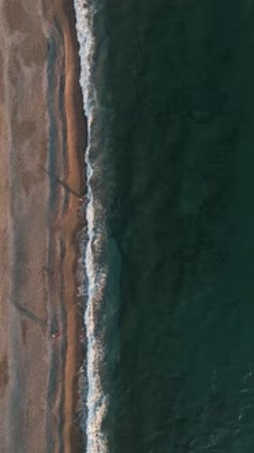 Vertical Video Aerial View of the Evening Beach Sea Texture in the Mediterranean Sea