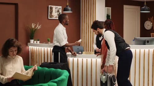 Newlywed Couple Checking in Posh Hotel