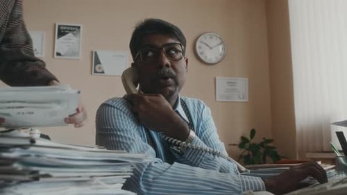 Busy Office Worker during Workday in Vintage Office