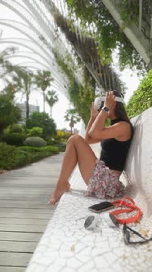 An Immersive VR Experience Takes Place Outdoors Where a Woman Enjoys the Lush Greenery