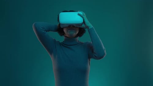 Woman Puts on a Virtual Reality Headset