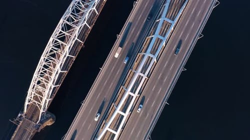 Aerial Drone View of Cars Driving on Bridge Over the River