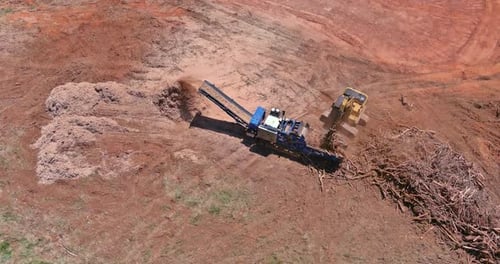 Wood Chipper and Bulldozer Clearing Land Aerial View