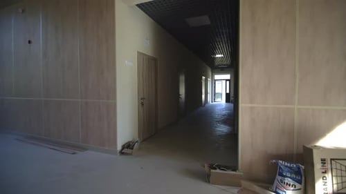 Hall of Building with Closed Doors in Stage of Renovation