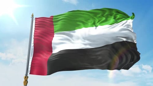 United Arab Emirates Flag Waving in Sunny Blue Sky