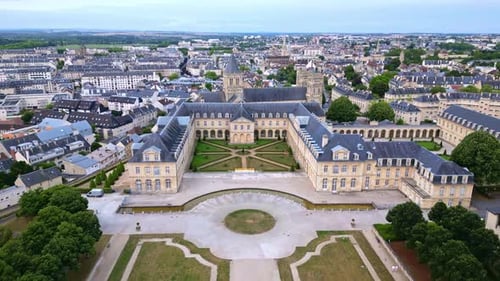 Receding aerial movement from the Ladies Abbey of Sainte-Trinité with Michel D'Ornano park, Caen, Fr