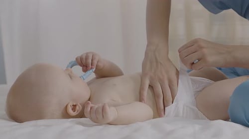 Changing Diaper on Infant in Hospital Setting