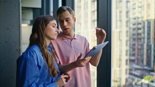 Couple Colleagues Discussing Strategy Talking at Panoramic Window Office Closeup