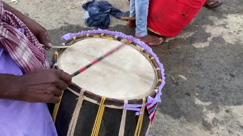 One isolated dhak ( drum ) was playing by someone on a puja in a village of West Bengal, India.