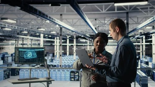 Team of Engineers in Server Hub Optimizing Deep Learning AI Systems