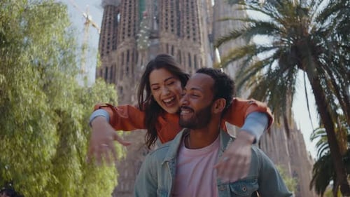 Young multiethnic couple visiting and dating in the center of Barcelona