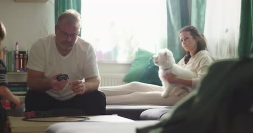 Father and Son Play with Toy Train