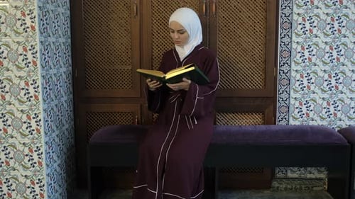 Woman Praying Quran On Mosque