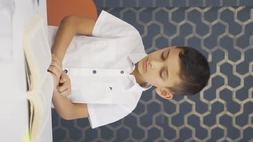 Vertical video of Boy is afraid and worried at home.