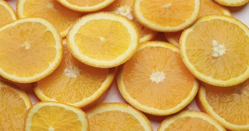 Top Down Background View Made of Fresh Sliced Organic Oranges Closeup