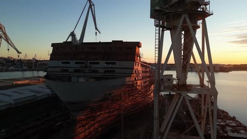 Aerial view of shipyard and cranes at sunset, Croatia.