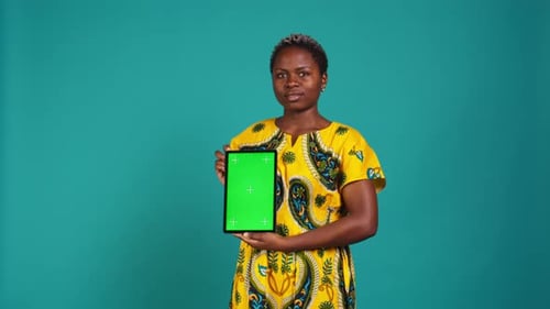 Gorgeous Model Presenting a Tablet with Green Screen Mockup