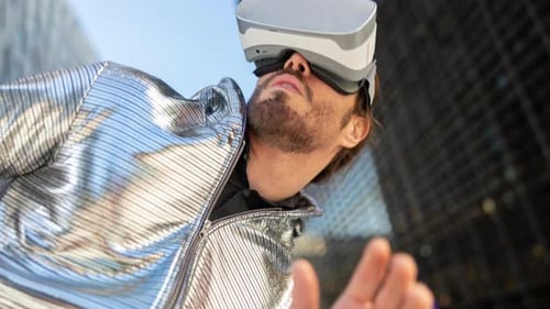 Young Man Wearing a VR Headset Outside