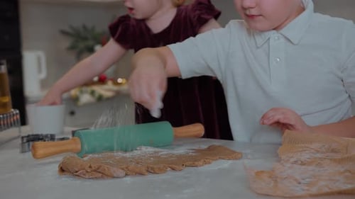 Children Making Christmas Cookies in Home Kitchen