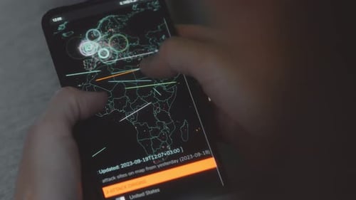 Phone Showing World Map of Cyber Attack Origins