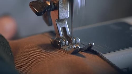 Sewing Machine Needle Stitches Fabric Close Up
