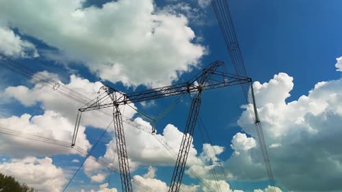 Electricity Pylon Standing Tall Against Cloudy Sky