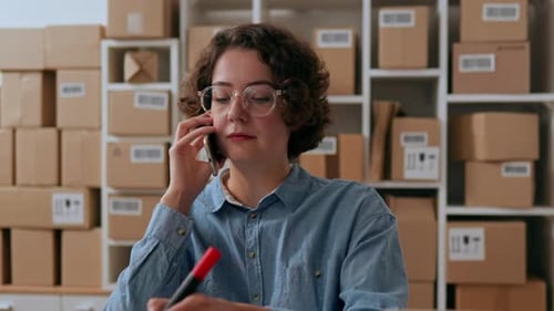 Woman Business Lady, Merchant, Small Business Owner Works Warehouse, Storage. Preparing Parcels