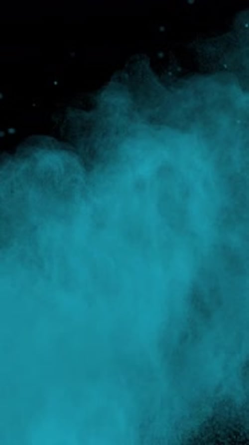 Super Slow Motion Shot of Blue Color Powder Explosion at 1000Fps Vertical View
