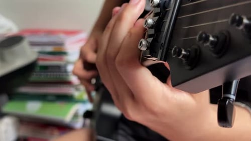 Hands Playing Electric Guitar Close Up Indoors